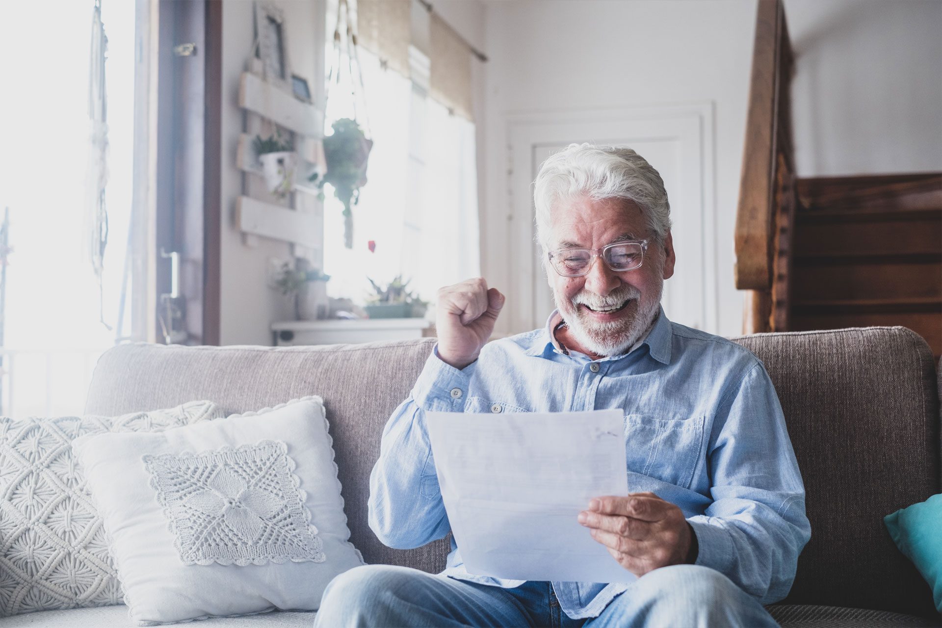 Risk Based Skin Cancer Surveillance excited senior man reading letter